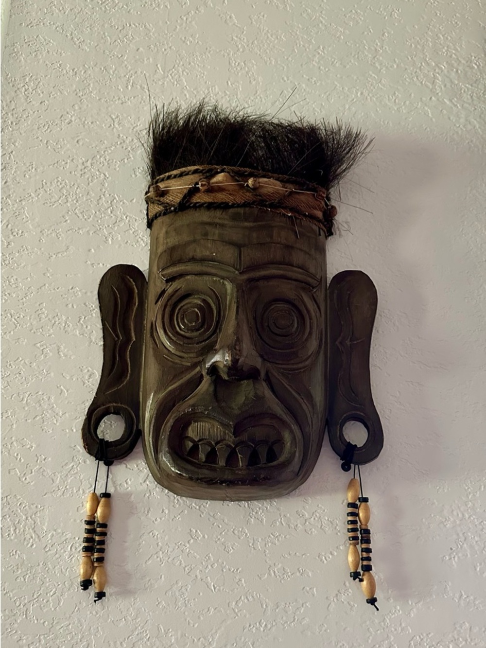 Hand-Carved Tribal Wooden Mask with Bead & Hair Accents - Dark Brown